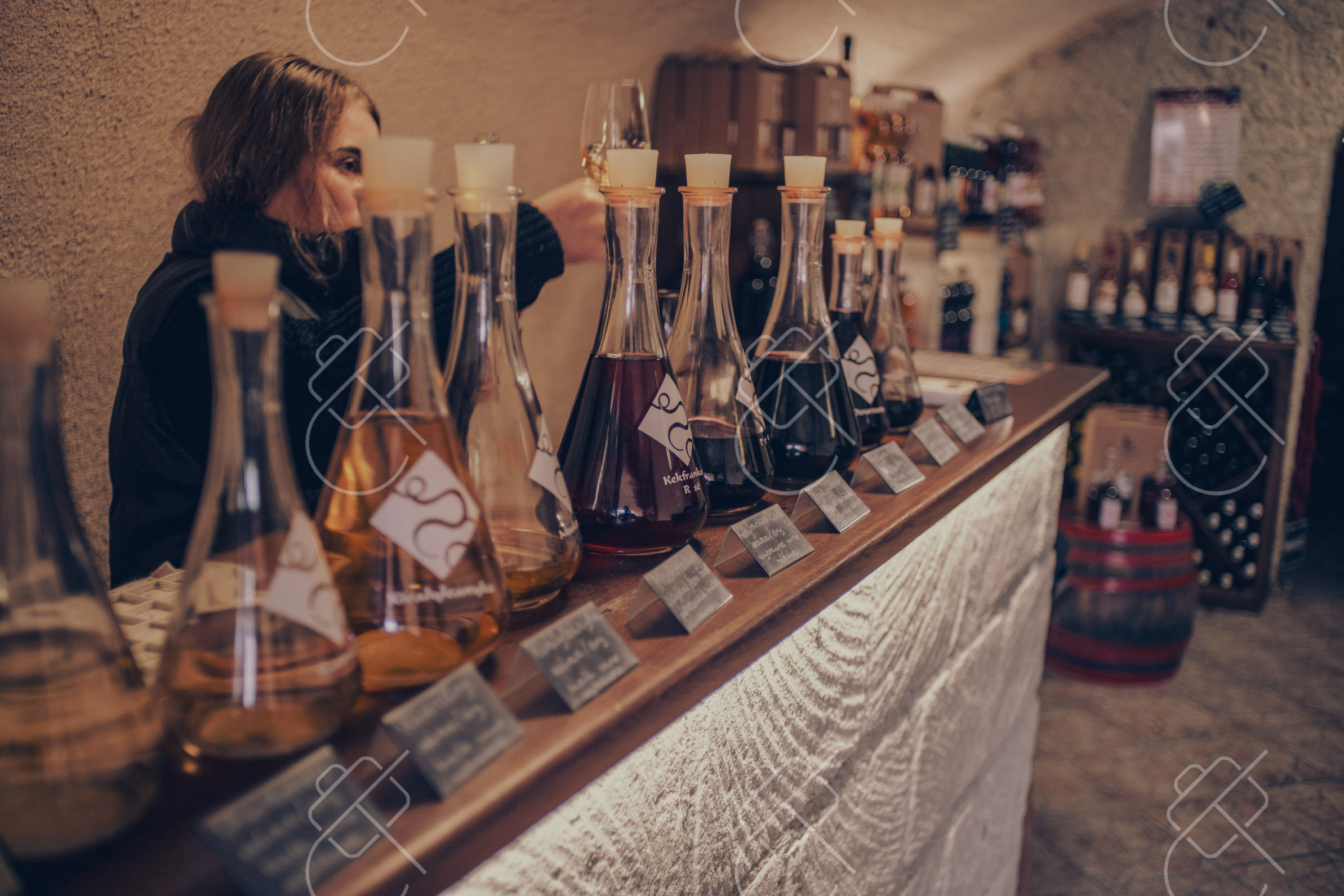 Wine drawn straight into glass flasks at a family cellar in the Valley of the Beautiful Women — Eger, fine art travel photography print available from Clever Tourists