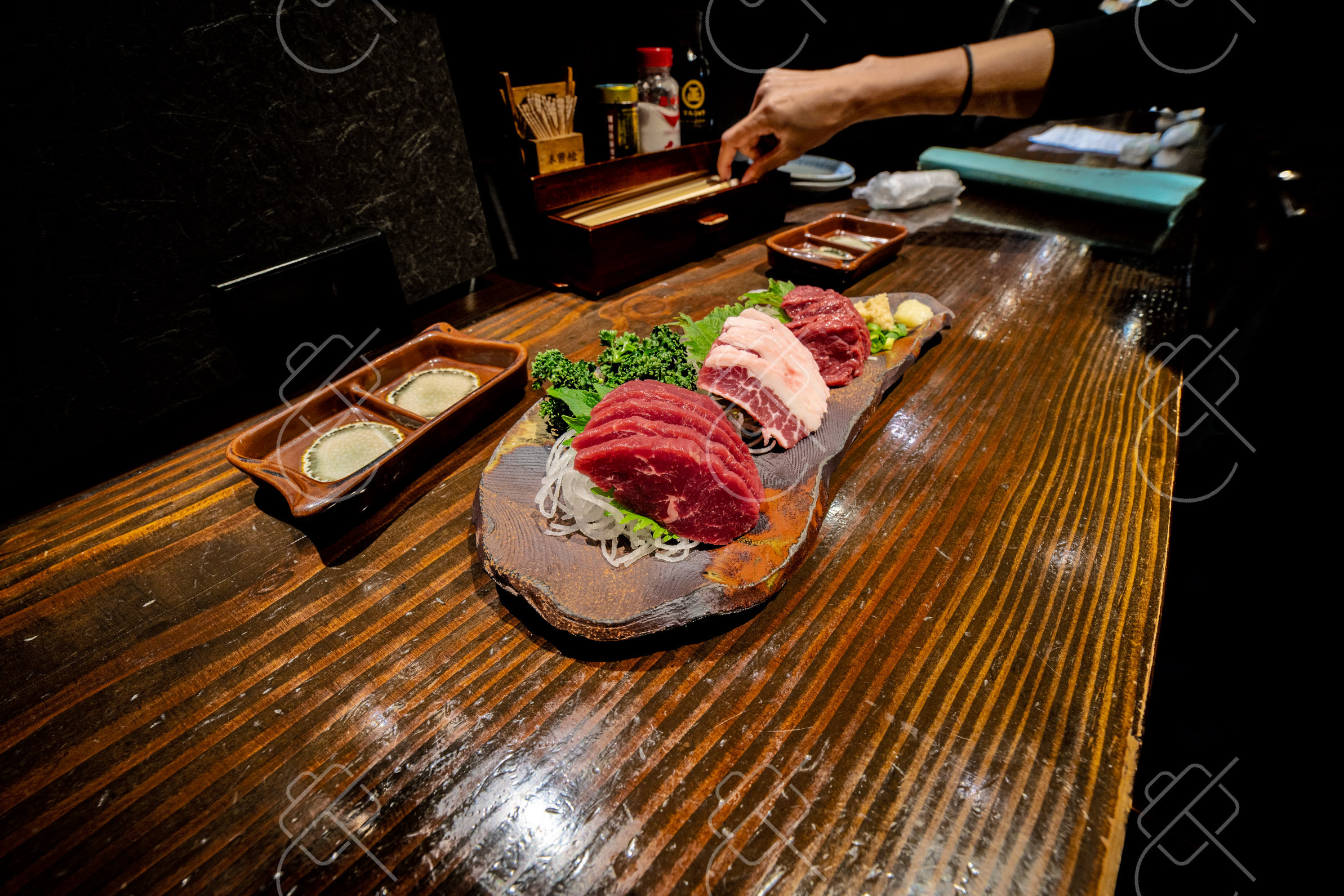 A platter of basashi, the raw horse sashimi Nagano is known for, served over ice — Matsumoto, fine art travel photography print available from Clever Tourists