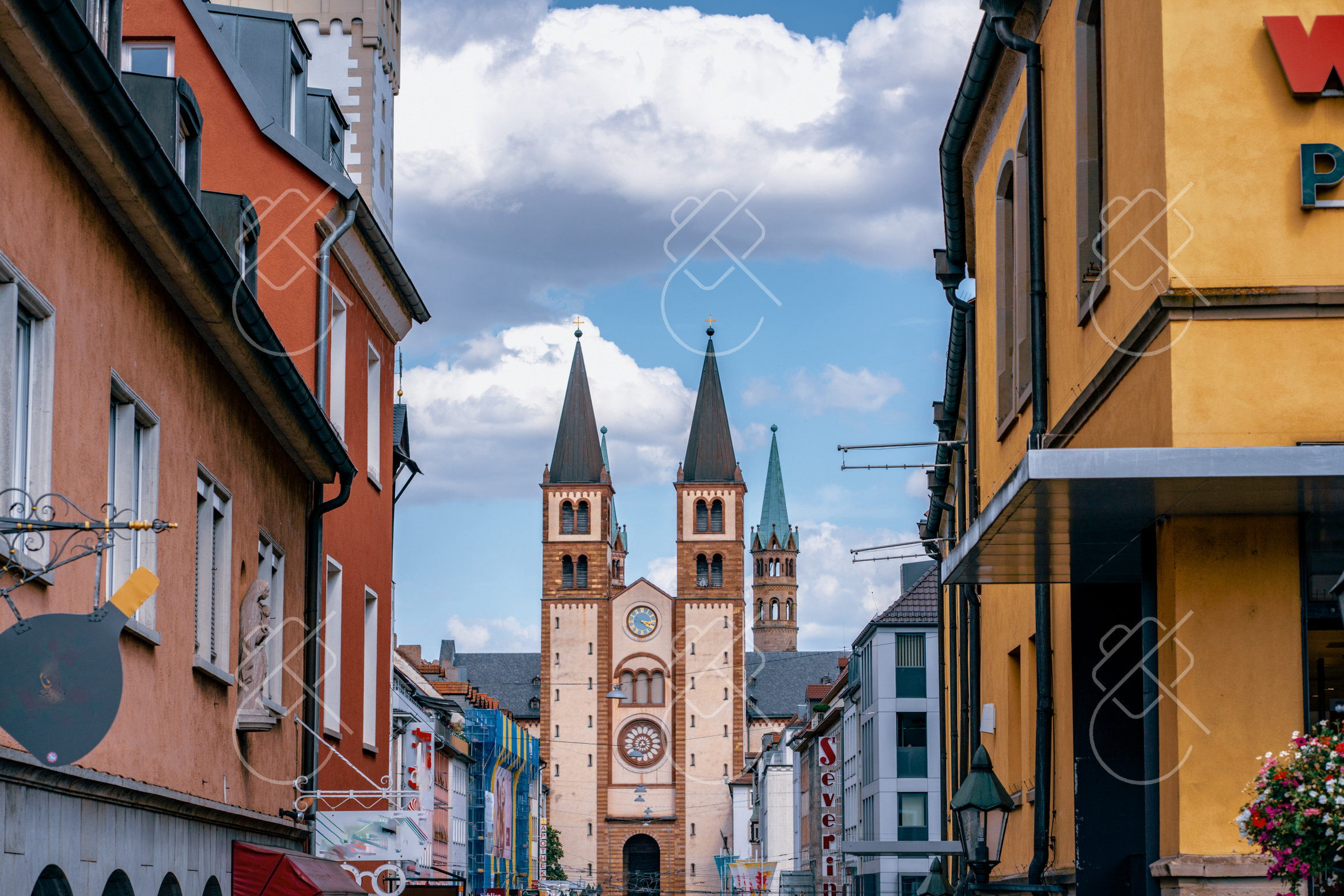Würzburg Cathedral's twin towers framed at the end of a street — Würzburg, fine art travel photography print available from Clever Tourists