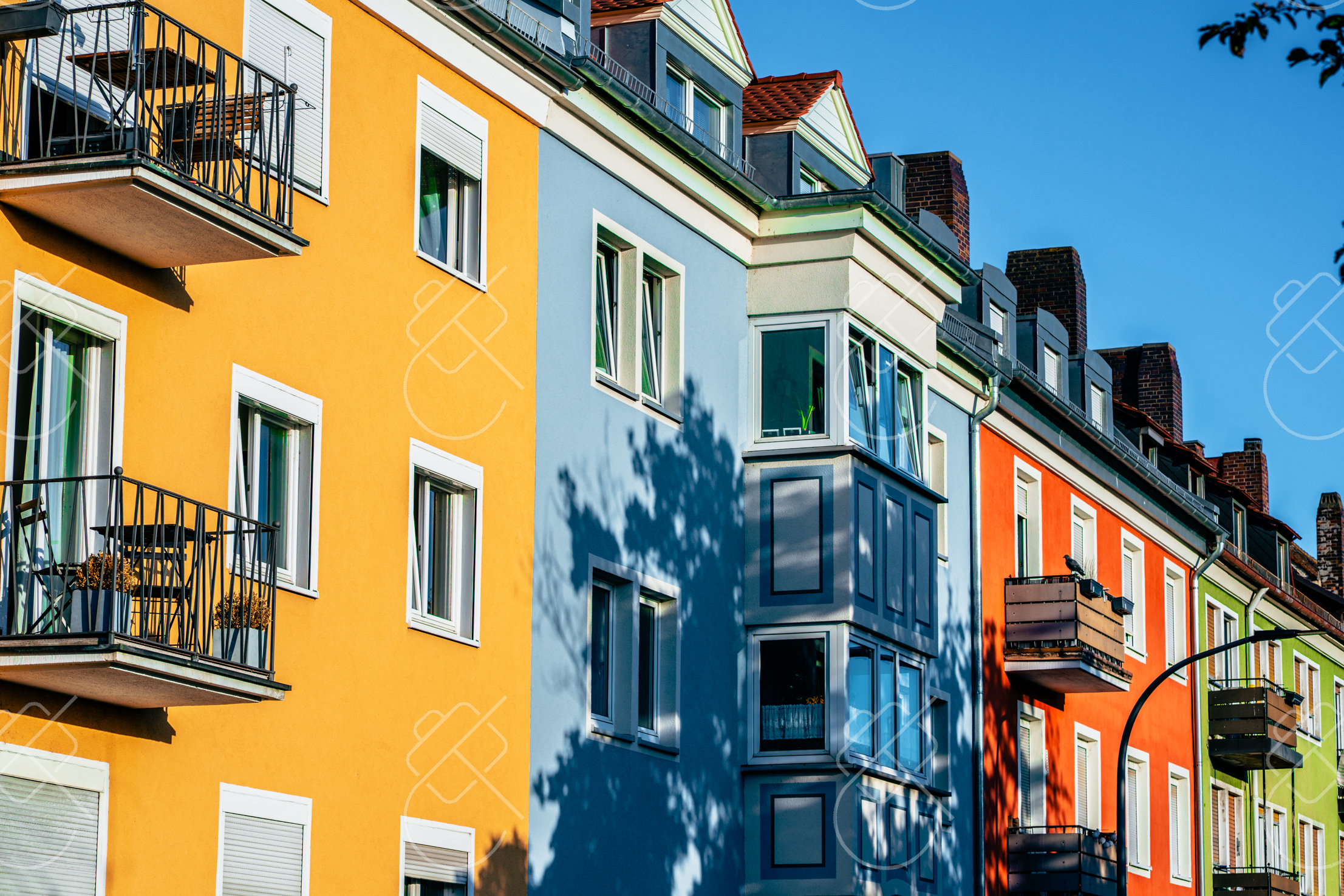 Colorfully painted row houses along a Würzburg old town street — Würzburg, fine art travel photography print available from Clever Tourists