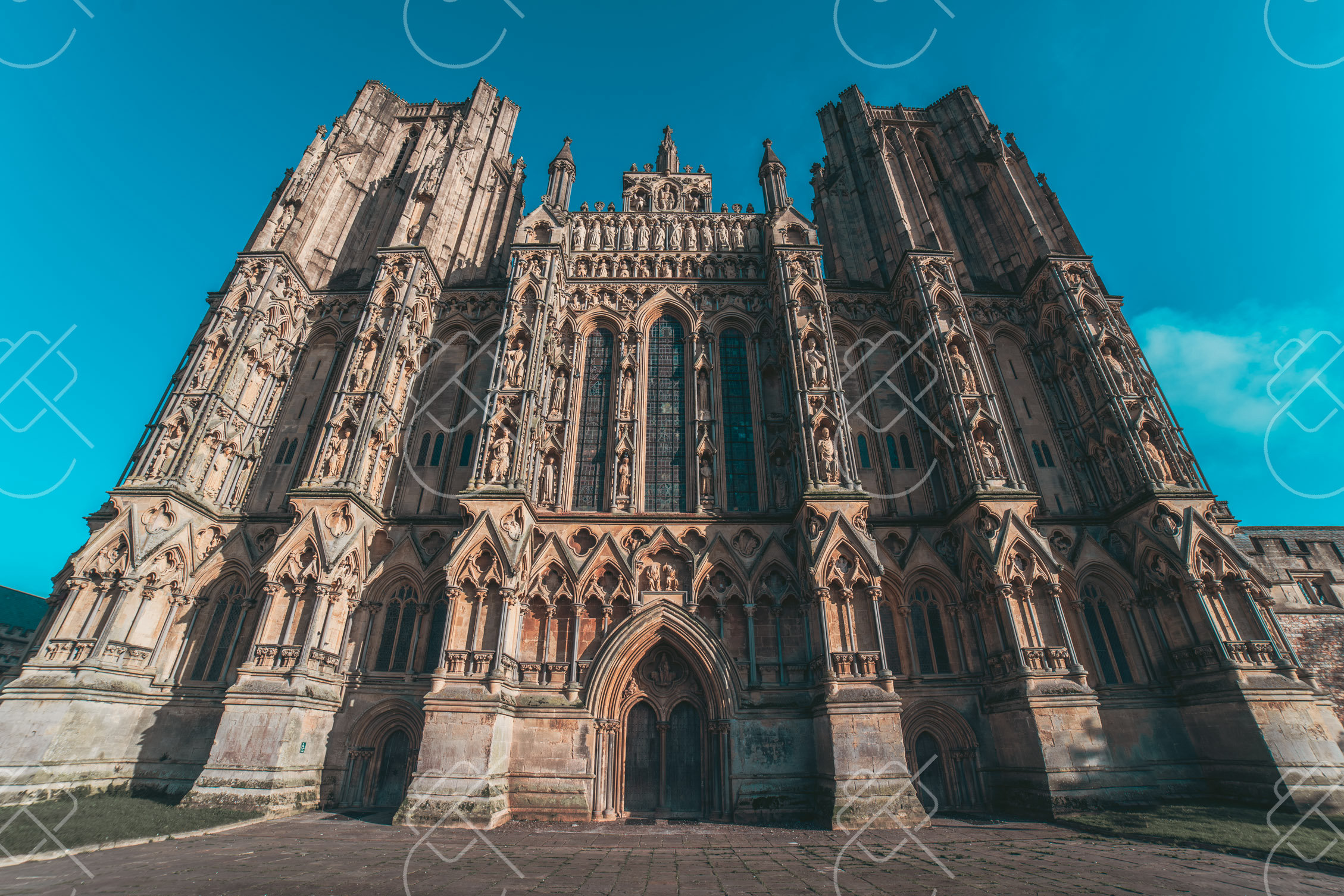 The tiered sculpture of Wells Cathedral's west front against a clear winter sky — Wells, fine art travel photography print available from Clever Tourists